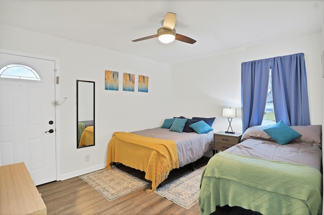 bedroom with hardwood / wood-style flooring and ceiling fan