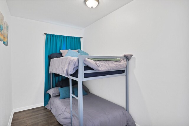 bedroom featuring dark hardwood / wood-style floors