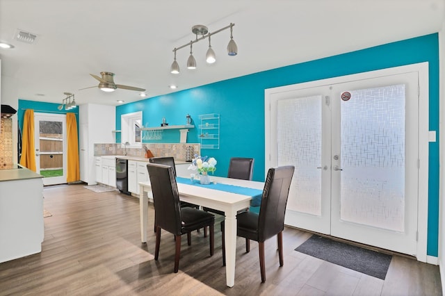 dining area featuring hardwood / wood-style floors, french doors, and ceiling fan