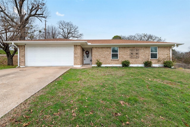 ranch-style home featuring a garage and a front lawn