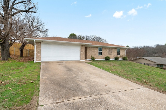 single story home featuring a garage and a front lawn