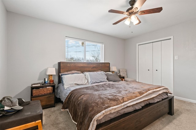 carpeted bedroom with a closet and ceiling fan