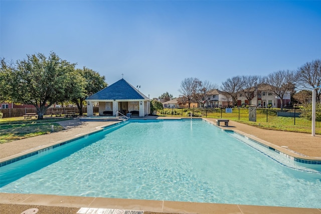 view of pool with an outdoor structure