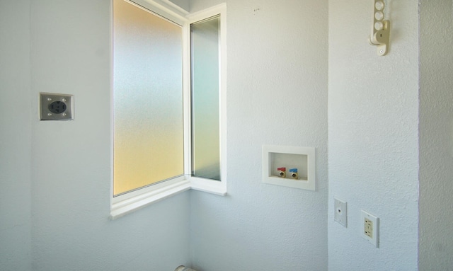 clothes washing area featuring washer hookup and electric dryer hookup