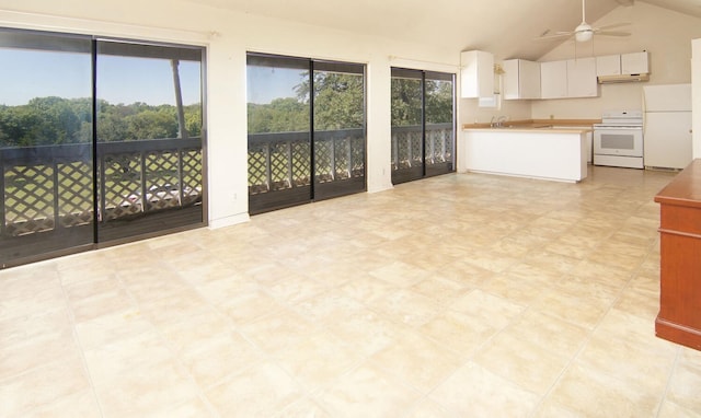 kitchen with ceiling fan, plenty of natural light, white cabinets, and white appliances