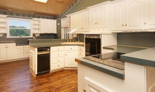 kitchen with dark wood-type flooring, white cabinets, wood ceiling, and sink