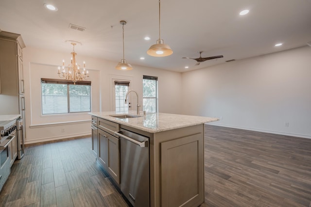 kitchen with sink, stainless steel appliances, decorative light fixtures, a kitchen island with sink, and ceiling fan with notable chandelier