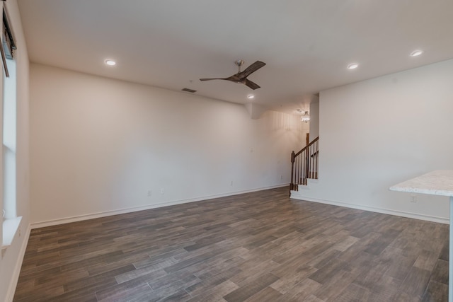 interior space featuring ceiling fan and dark hardwood / wood-style flooring