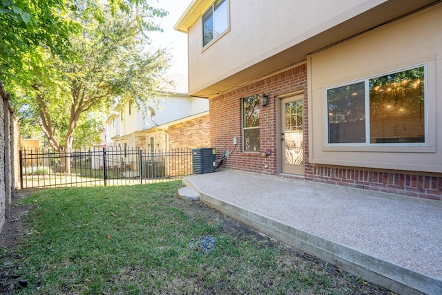 view of yard with a patio area and central air condition unit