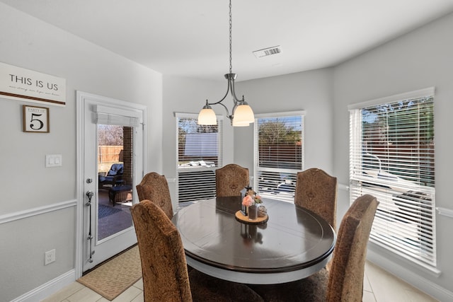 dining space featuring light tile patterned floors