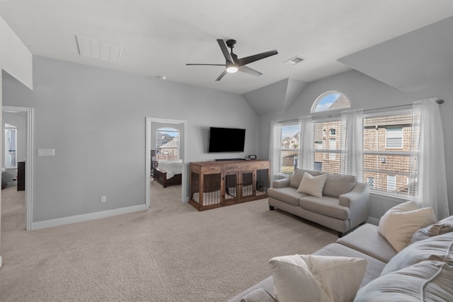 carpeted living room featuring lofted ceiling and ceiling fan