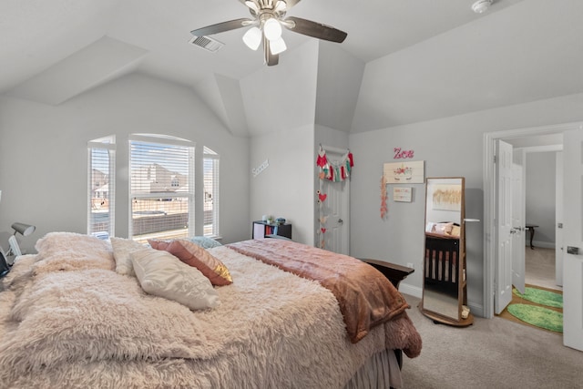 carpeted bedroom with vaulted ceiling and ceiling fan