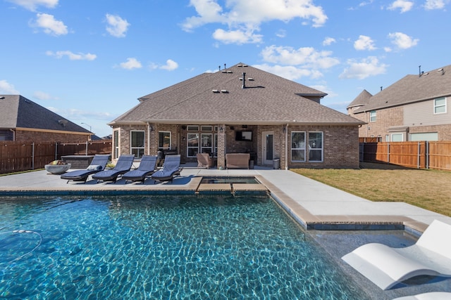 view of swimming pool with a patio area and a lawn