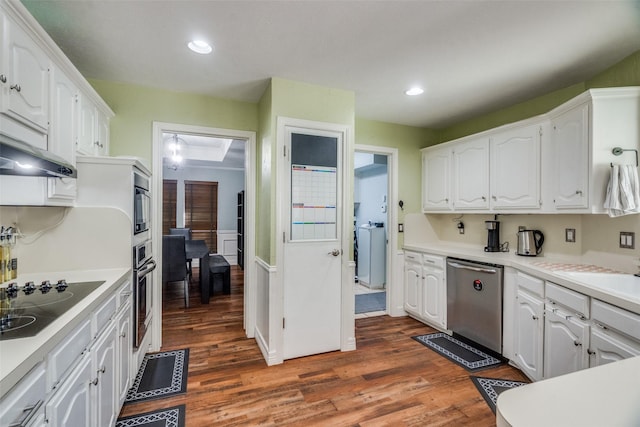 kitchen featuring sink, white cabinetry, stainless steel appliances, and dark wood-type flooring