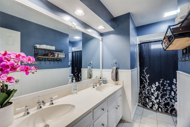 bathroom featuring tile patterned floors and vanity