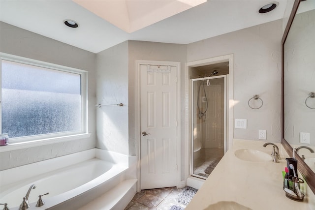 bathroom featuring separate shower and tub, tile patterned floors, and vanity