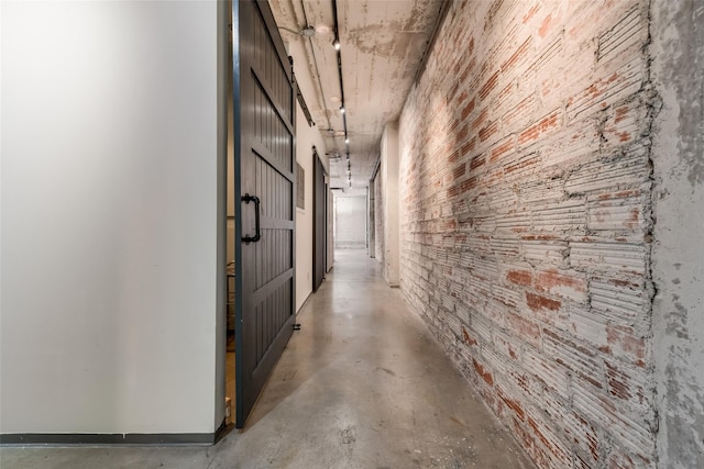 hallway featuring concrete flooring