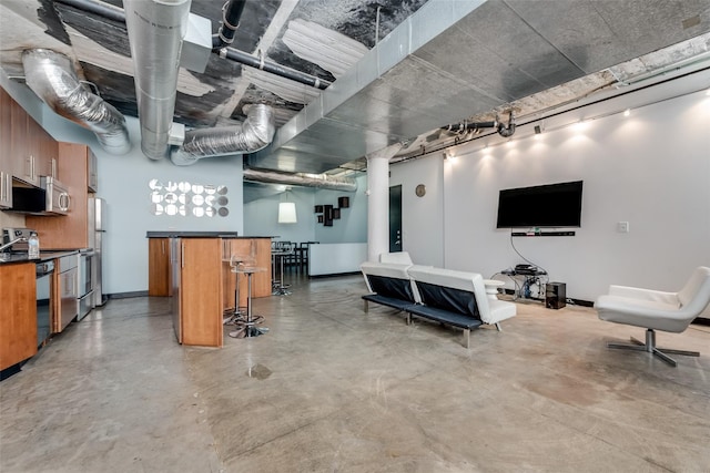 basement with stainless steel fridge