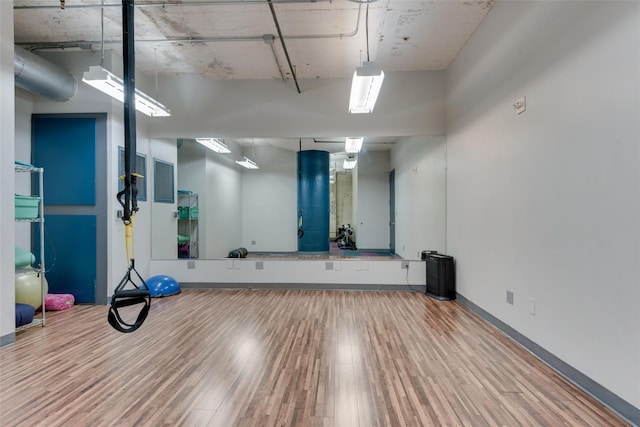 exercise area with wood-type flooring