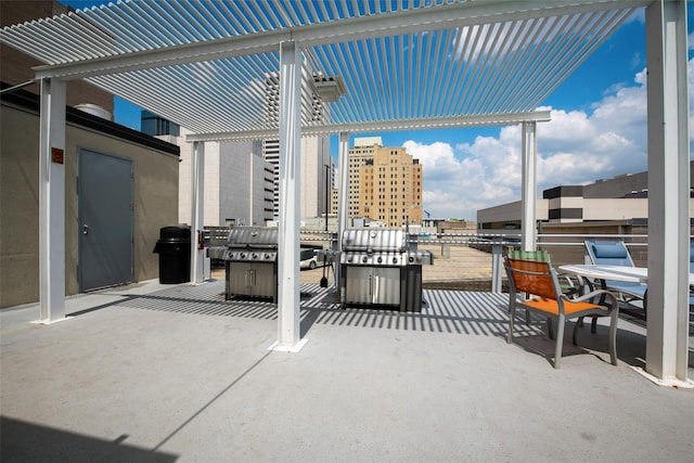 view of patio with a grill and a pergola