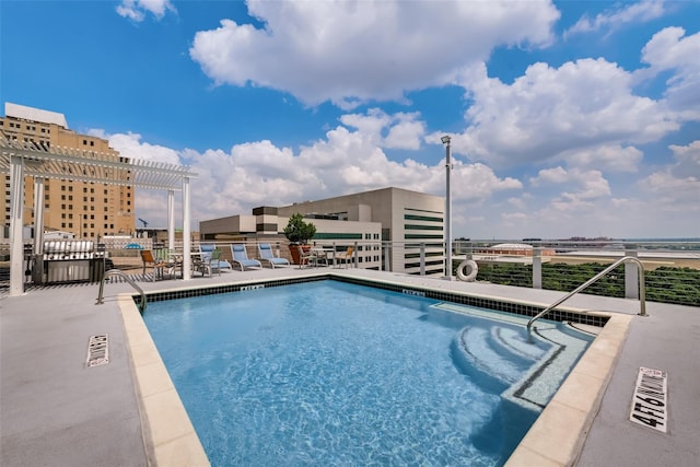 view of pool with a pergola and a patio area