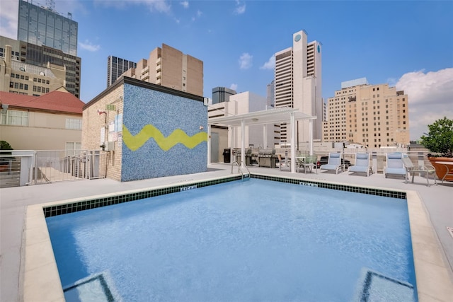 view of swimming pool with a patio area