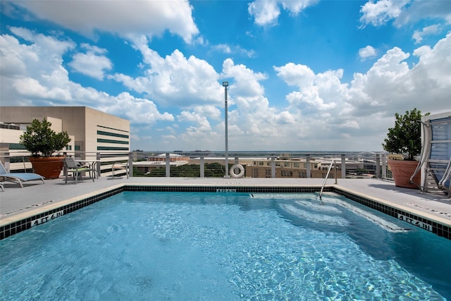 view of pool featuring a patio