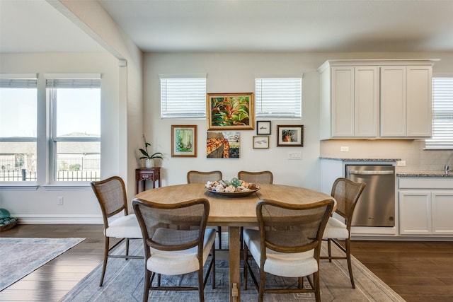 dining space featuring dark hardwood / wood-style flooring