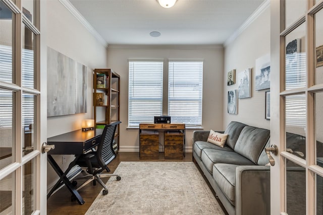 home office with hardwood / wood-style floors, french doors, and ornamental molding