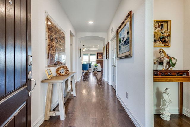 foyer featuring ceiling fan and dark wood-type flooring