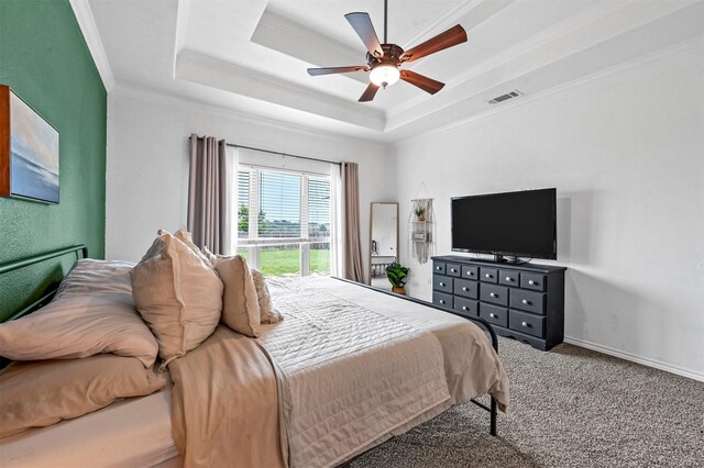 bedroom featuring visible vents, access to exterior, crown molding, a raised ceiling, and carpet flooring