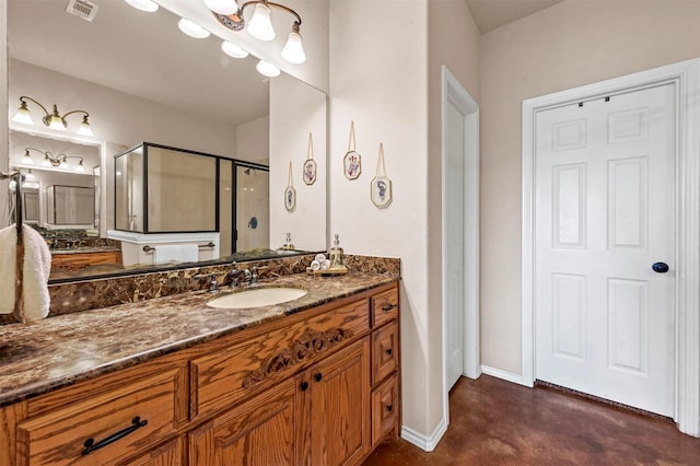 bathroom with visible vents, a shower stall, baseboards, finished concrete floors, and vanity