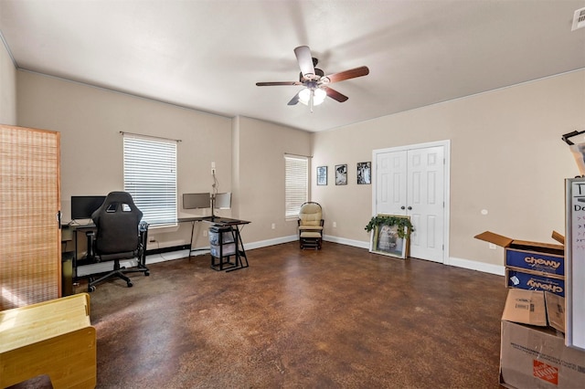 office space with visible vents, baseboards, concrete flooring, and ceiling fan