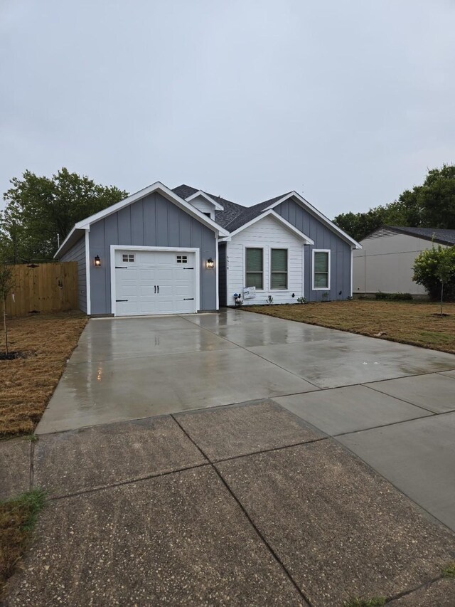 ranch-style house featuring a garage