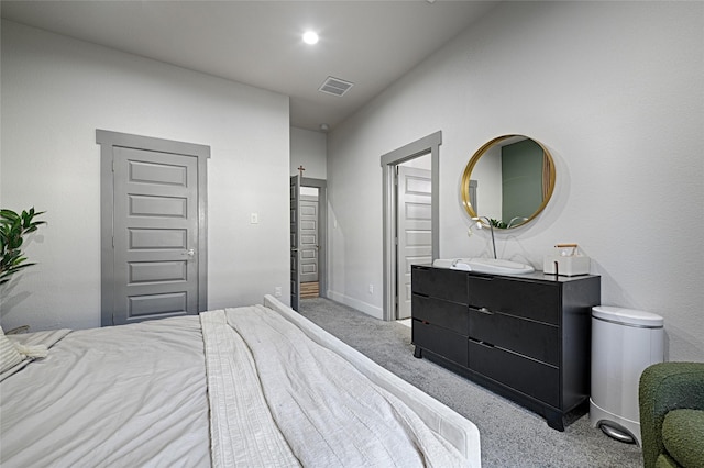 bedroom featuring light carpet