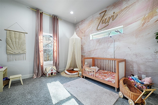 carpeted bedroom featuring a crib