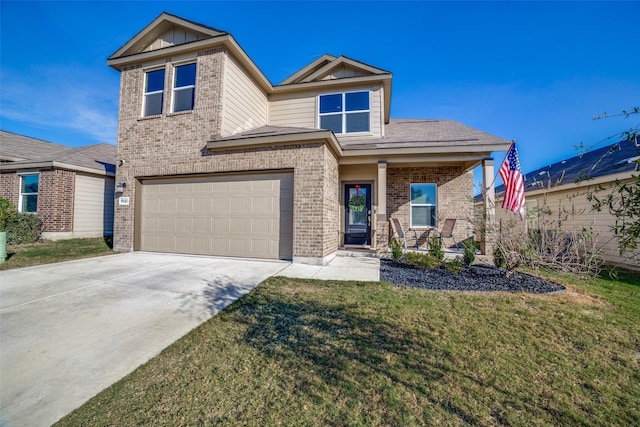 view of front of home with a front lawn and a garage