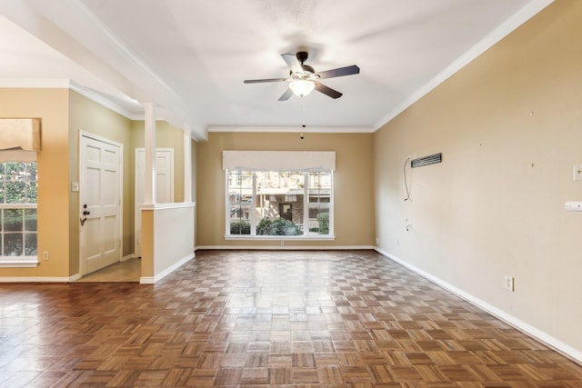 spare room with ceiling fan, crown molding, and dark parquet floors