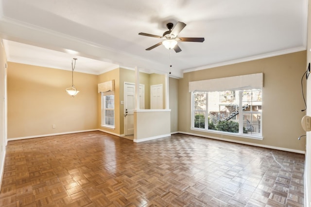 spare room featuring ceiling fan, ornamental molding, and parquet flooring