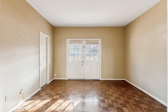 empty room featuring french doors and parquet floors