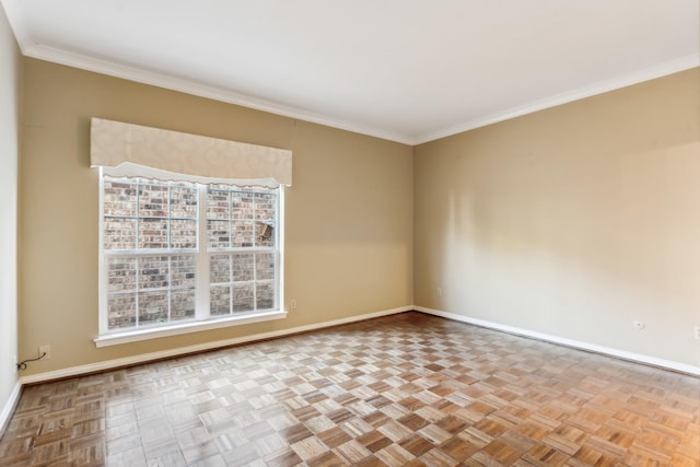 spare room featuring crown molding and light parquet floors