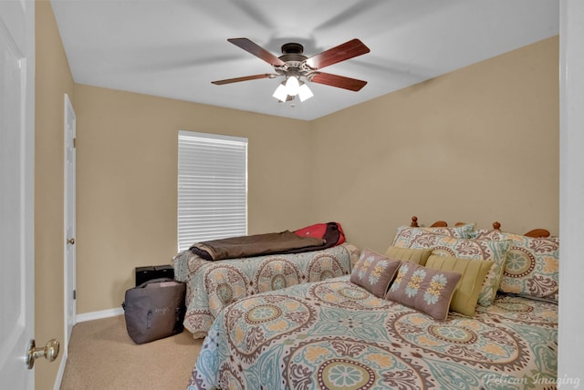 bedroom featuring ceiling fan and light colored carpet