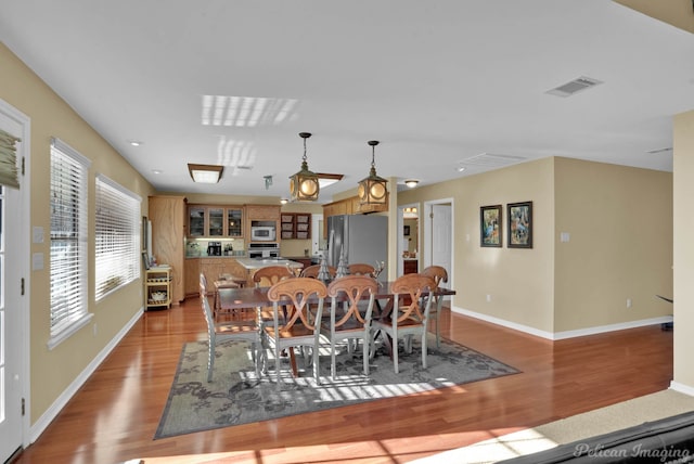 dining room with light wood-type flooring