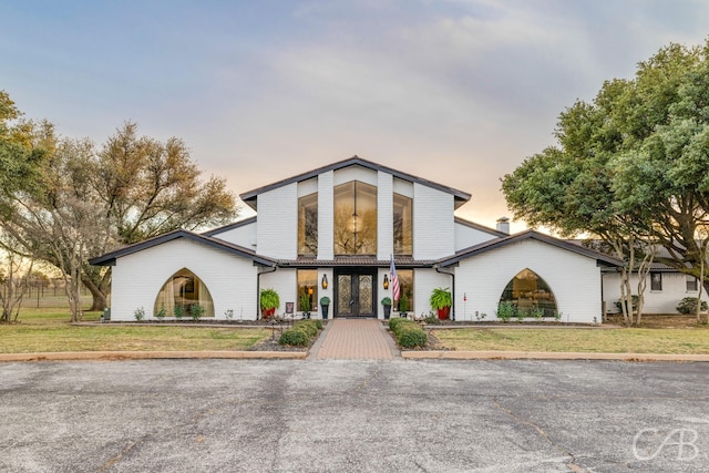 view of front of home with a lawn