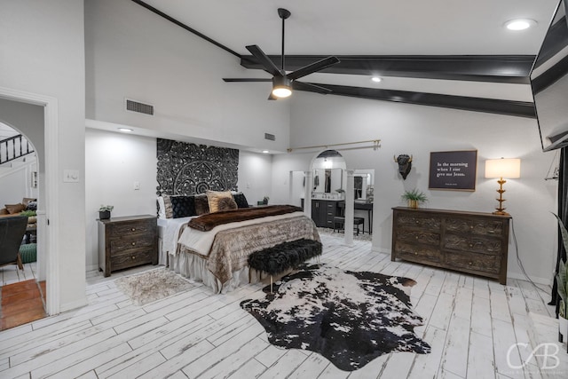 bedroom with high vaulted ceiling, ceiling fan, and light wood-type flooring