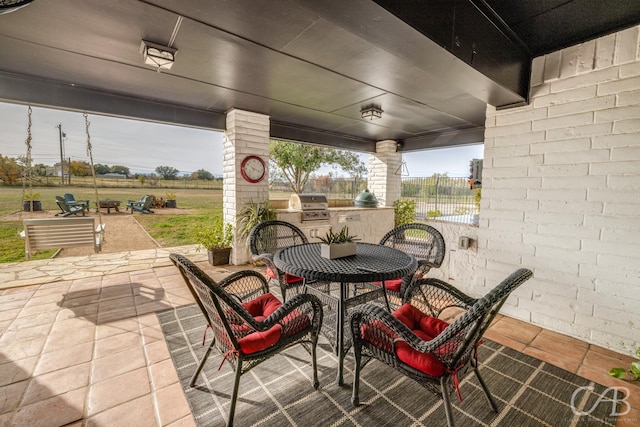 view of patio / terrace featuring grilling area and exterior kitchen