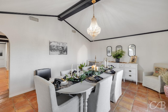 tiled dining space with an inviting chandelier and lofted ceiling with beams