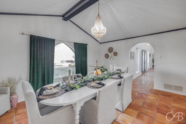 dining area featuring tile patterned floors, a chandelier, and lofted ceiling with beams