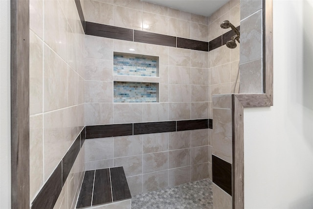 bathroom featuring tiled shower