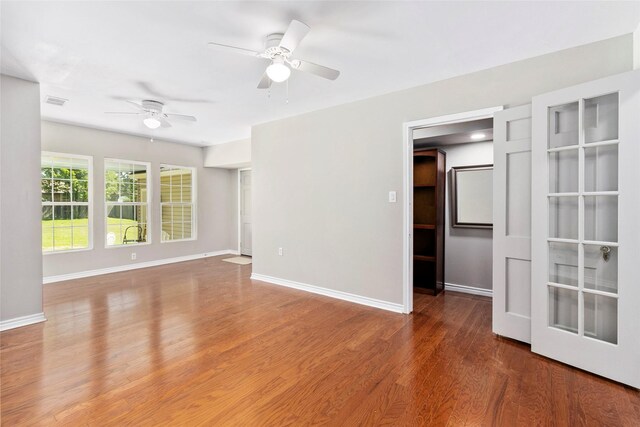 spare room featuring ceiling fan and hardwood / wood-style floors